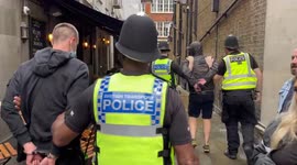 Scotland fans cheer as police arrest two 'England supporters' in London