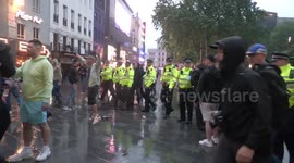 Scuffles in Leicester Square, London as England and Scotland football fans clash with police
