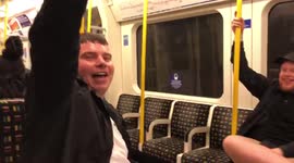 Upbeat England supporters sing the national anthem for b the tube following England and Scotland’s 0-0 draw in the Euros