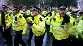 Police clash with fans in London's Leicester Square during England-Scotland game