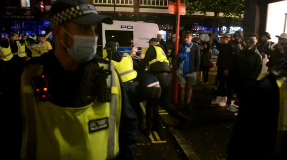 Fans clash with police in London's Leicester Square during England-Scotland match