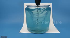 YouTuber makes 'tornado' that changes colour as it spins in container