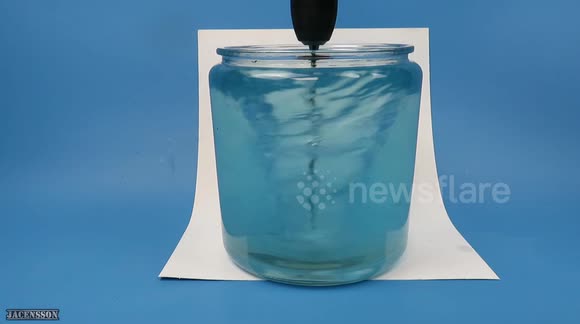 YouTuber makes 'tornado' that changes colour as it spins in container