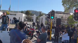 Cape Town police boss heckled by homeless man during gun law protest