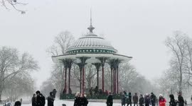 Snow by the bandstand of Clapham Common London, winter 2021. Beautiful rare Christmas Postcard Scene of white winter in South London.