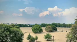 Beautiful Clouds British Summer in London dry Heatwave which left Clapham Common with a rare sight with yellow grass