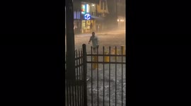 Storm batters Bloomington, Indiana, but one resident dives into the floodwaters