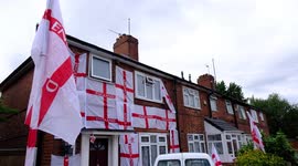 England football fan who covered his home in flags to support his home country has kept them flying despite threats