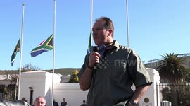 Leader of South African gun association speaks at gun law protest outside parliament