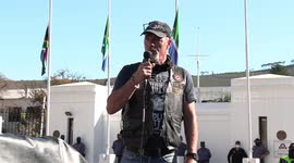 Biker group leader speaks at gun law protest outside South Africa's parliament