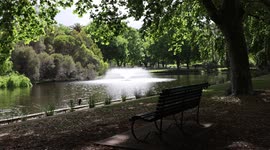Bench in Hyde Park with fountain in background. Perth Western Australia