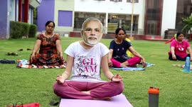Woman wears mask depicting PM Modi, perform Yoga on International Yoga Day in Rajasthan