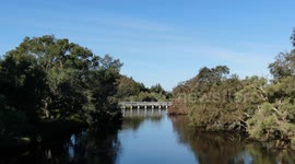 Canning River at Kent Street Weir bridge on a sunny blue sky day