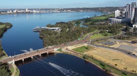 Perth City Causeway traffic and Jet Skies going under bridge on Swan River