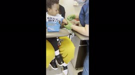 'Unfazed Toddler Casually Watches Phlebotomist Drawing his Blood'