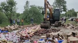 Excavator used to destroy alcohol worth almost $60,000 in western India