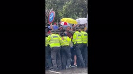 Police are physically stopping the protesters blocking the road ….  Heavy police presence at Parliament Square, London Anti Lockdown Protest on Postponed