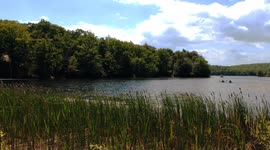 Couple Kayaking in the beautiful Highland Lakes of New Jersey in Spring via Drone
