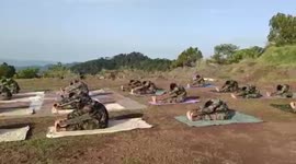 Defense personnel perform yoga on occasion of 7th International Yoga Day in northern India