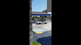 Terrifying police standoff with allegedly armed driver at LA gas station captured by brave filmer