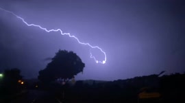 Lightning strike streaks across whilst storm chasing, South Germany.