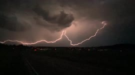 Lightning strike streaks across whilst storm chasing, South Germany.