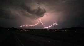 Lightning strike streaks across whilst storm chasing, South Germany.