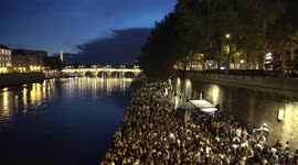 Hundreds celebrating music festival gather on banks of Paris river without social distancing