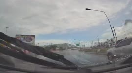 Pick-up truck spins out-of-control after rain leaves road wet and slippery