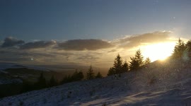 Snow caught in the light of the morning on the side of a mountain in Scotland