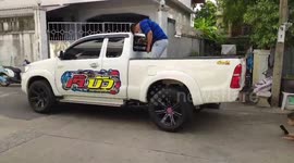 Huge python sparks panic after it was found hiding under a pick-up truck