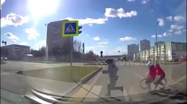 Russian motorist manages to swerve last second to avoid kids running across road