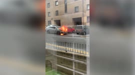Dramatic moment a taxi bursts into flames at a parking lot in Glasgow