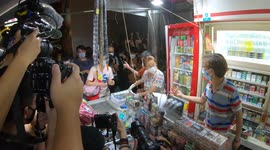 First customers grab Apple Daily from the shelves as it hits the newstands at 1 AM