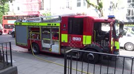 Fire brigade and ambulance tackle the fire on Earls Court Road in Kensington