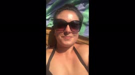 Finally at peace on the beach in Bali, shaded by a four poster sunlounger