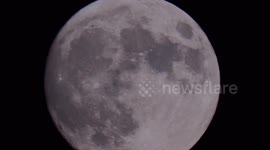 Nearly full Strawberry Supermoon seen rising in Kent, UK