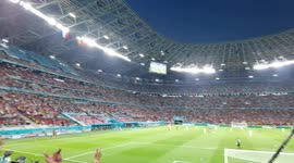 As a screen announcement confirms Hungary has taken the lead against Germany, the crowd cheers even more in Budapest stadium