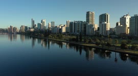 Perth City skyline reflections drone video over Swan River along Riverside Drive Perth, Western Australia
