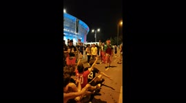 French fans carrying a Portuguese fan to help him join the fun