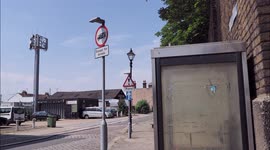 Phone box in shadow of phone mast due to be removed in Kent, UK