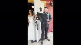 Groom bursts into tears after he is handed photo of himself with late grandmother