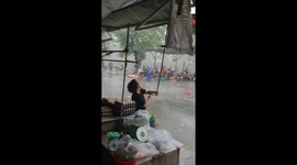 Rain and wind causes havoc at Vietnamese market as tornado sweeps through area