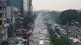 Fire trucks in Philippines honour former president Aquino with water salute