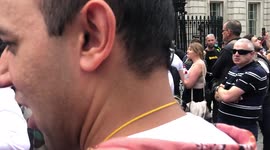 Celebrity Laurence Fox at anti lockdown Downing Street protest - shouting in protest over cover restrictions.