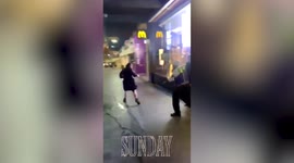 Shocking footage shows UK McDonald's security guard battering and kicking woman who threw nearly empty drink over him