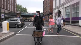 Police officers guard piles of MANURE as protest hits Murdoch HQ in London