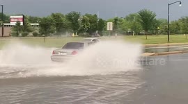 Drivers risk crossing severely flooded roads in Indiana city
