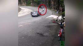 Driverless car rolls down road into wall as motorist forgets to pull handbrake