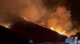 Wildfire burns 1,200 acres near freeway in California